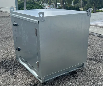 Expert inspecting a smaller exhaust fan for optimal air quality.