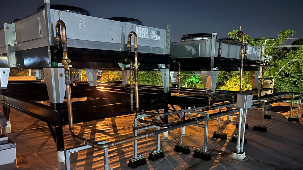Rightway A/C & Refrigeration technicians installing HVAC systems in a new construction project.