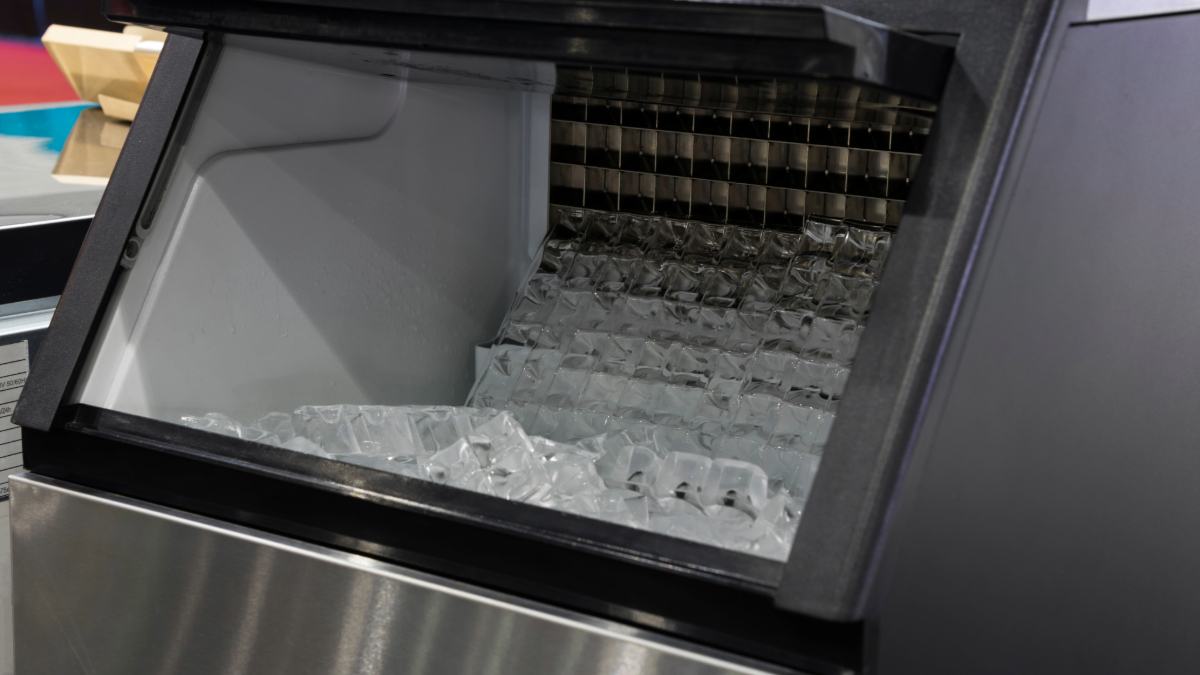 Technician from Rightway A/C & Refrigeration servicing an ice machine for consistent ice production.