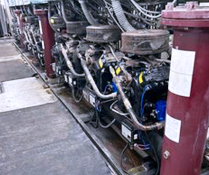 Expert inspecting a supermarket refrigeration system to ensure efficiency and reliability.
