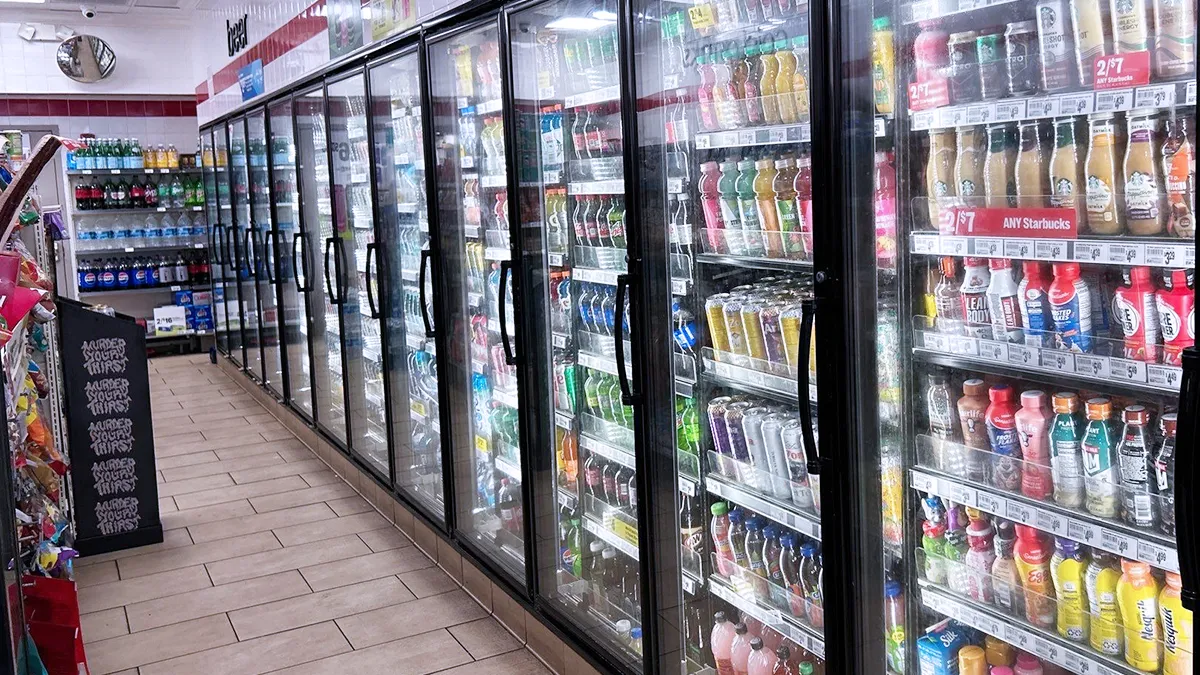 Technician from Rightway A/C & Refrigeration servicing a walk-in cooler for optimal performance.